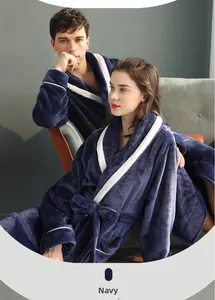 Detail view of navy blue flannel bathrobe with contrast white lapels and belted waist