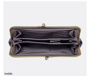 Detailed interior of vintage leather kiss-lock wallet with card slots and large capacity
