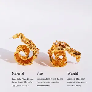 Elegant gold leaf earrings crafted in brass with sparkling zircon and 925 silver needles