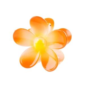 Detailed view of flower-shaped hair claw clip in orange and yellow gradient finish