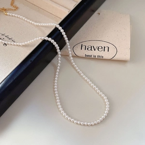 Elegant 925 sterling silver necklace with small white pearls and golden lobster clasp