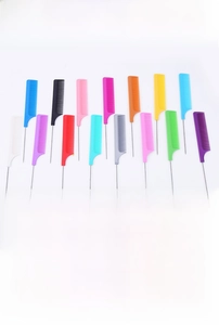 Macro view of multi-colored tail combs with thin steel needles and plastic handles