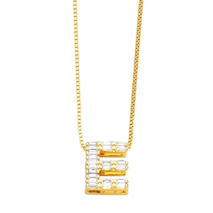 Close-up of golden letter E necklace pendant with sparkling cubic zirconia stones