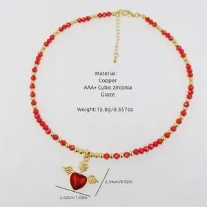 18k gold plated copper beaded necklace with winged red heart pendant and cubic zirconia