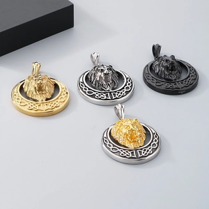 Detail of lion head pendants in gold, silver, and black with Celtic knot patterns