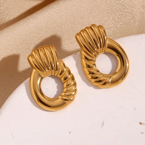 Close-up of 18K gold plated stainless steel hoop earrings with twist texture detail