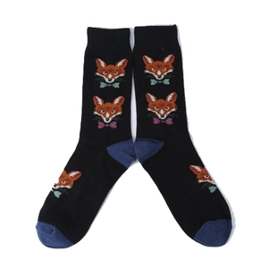 Detail of black crew socks featuring repetitive cartoon fox patterns with colorful bowties