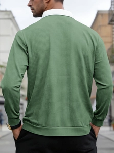 Outdoor back view of men's green waffle polo shirt with white collar contrast detail