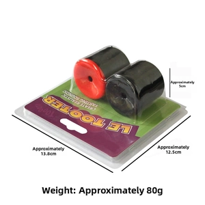 Detailed close-up of LE TOOTER prank noise maker in red and black blister packaging