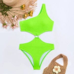 Detail view of neon green one-shoulder swimsuit with metal ring and waffle texture