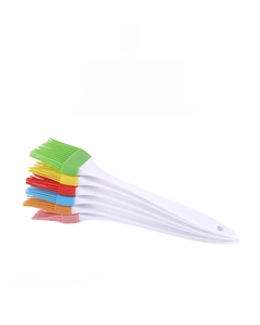Set of six colorful silicone oil brushes with white handles and integrated hanging holes