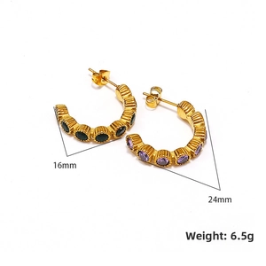 Detail of gold C-shaped earrings with purple and green stones showing size dimensions