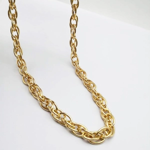 Detail of a 60cm KC gold twisted rope chain necklace with polished circular link texture