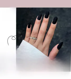 Detailed view of matte black press-on nails in elegant almond shape for professional look