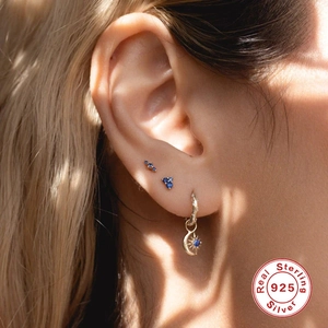 Elegant 925 sterling silver gold earrings set with blue gemstones moon and sun charms