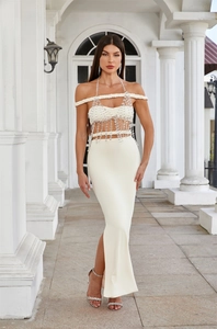 Detailed view of luxury beaded fringe on ivory halter top and slim fit mermaid skirt set