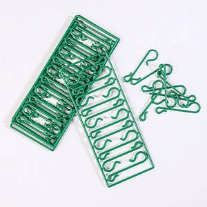 Green plastic S-shaped ornament hooks for Christmas tree decorations in set of frames