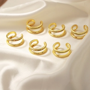 Set of 6 double-layered gold geometric rings with colorful rhinestones on white silk
