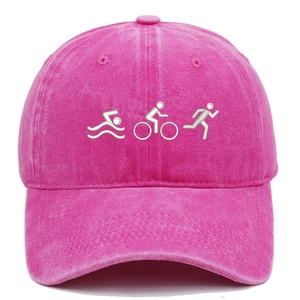 Detailed view of white triathlon embroidery on a rose pink washed cotton baseball cap