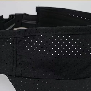 Detail of breathable mesh fabric and adjustable plastic buckle on black outdoor sun hat