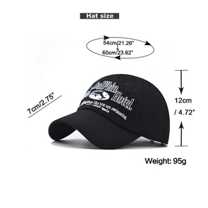 Detail showing dolphin embroidery and measurements of the washed cotton baseball cap