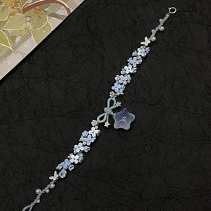 Blue resin flower bracelet with white pearls and silver butterfly star pendants