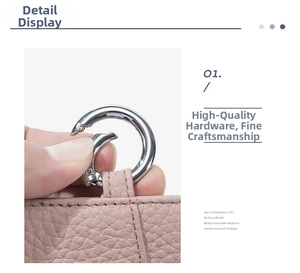 Close-up of pink lychee grain leather with high-quality silver metal ring and stitching