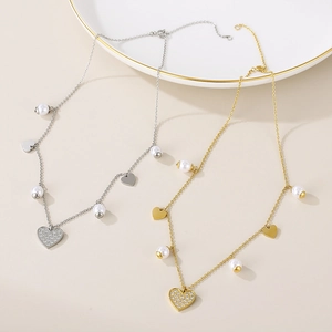 Polished heart pendant necklaces with white pearls and sparkling zircons in gold and silver