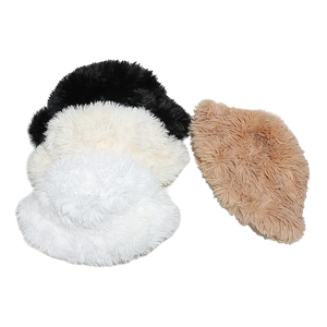 Detailed close-up of plush faux fur texture on bucket hats in various soft neutral colors