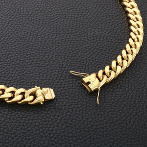 Detailed close-up of the secure spring buckle clasp on a 13mm golden Cuban link chain