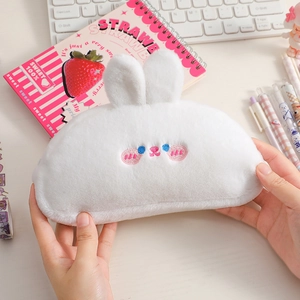 Cute white plush rabbit pencil case with embroidered facial details held by two hands