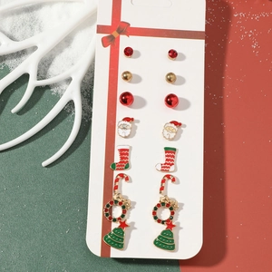 Detail view of a 7-pair Christmas earring set with Santa Claus and reindeer designs