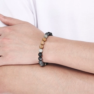 Close-up of mixed natural stone beaded bracelet with grey, white and marble textures