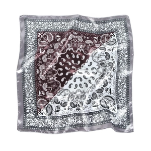 Silk satin square scarf featuring red and white paisley print with grey borders