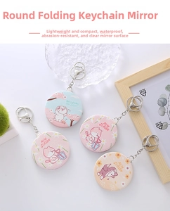 Detail view of mini foldable PU leather makeup mirrors with cute animal prints and keychains