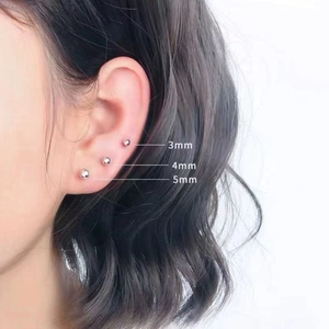 Three sizes of 3mm, 4mm, and 5mm ball stud earrings shown on a model's ear
