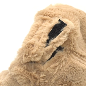 Detailed view of camel faux fur baseball cap with adjustable black velcro closure