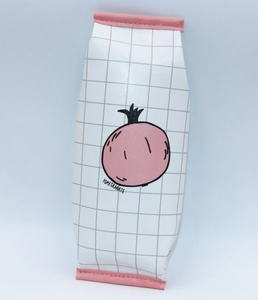 Detail of grid pattern pencil case featuring pink pomegranate print and leather piping