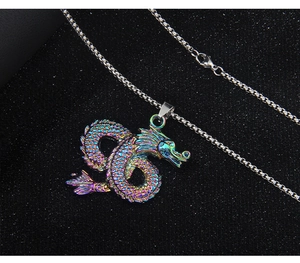 Macro shot of colorful rainbow Chinese dragon totem pendant on polished metal chain