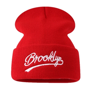 Red Brooklyn knit beanie with white embroidery and folded cuff for unisex outdoor warmth