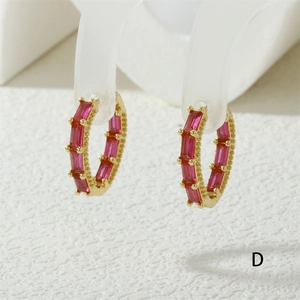 Detail of 18K gold plated hoop earrings featuring rectangle red zircon stones and bead edges