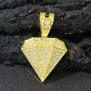Close-up of a gold 3D pyramid pendant necklace with glittering clear rhinestones inlay