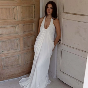 Elegant white halter neck maxi dress with deep V-neck and pleated mesh texture for summer