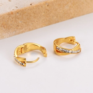 French luxury gold plated criss-cross earrings with inlaid diamonds on stone base