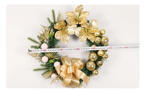 Measuring golden Christmas wreath with ball ornaments, measuring 40-45cm in diameter