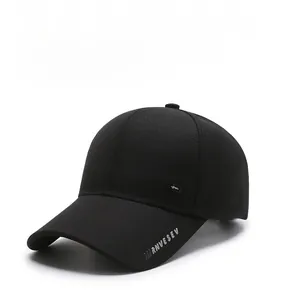 Close-up of black baseball cap featuring RNVESEV lettering and side shield emblem