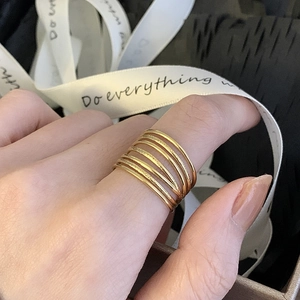 Wide hollow 18K gold plated titanium steel multilayer ring set displayed in a gift box