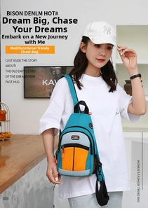 Detailed view of a multi-color casual crossbody bag with blue, grey, and orange panels