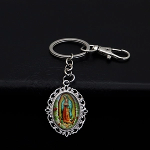 Detail of silver filigree Virgin of Guadalupe keychain with lobster clasp and keyring