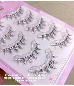 Detailed close-up of 5 pairs of natural soft false eyelashes on transparent stems